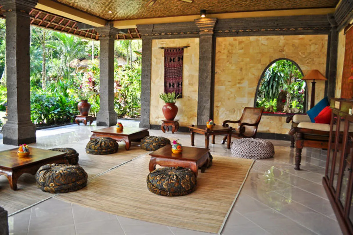 An open pavilion with a lounge and rug