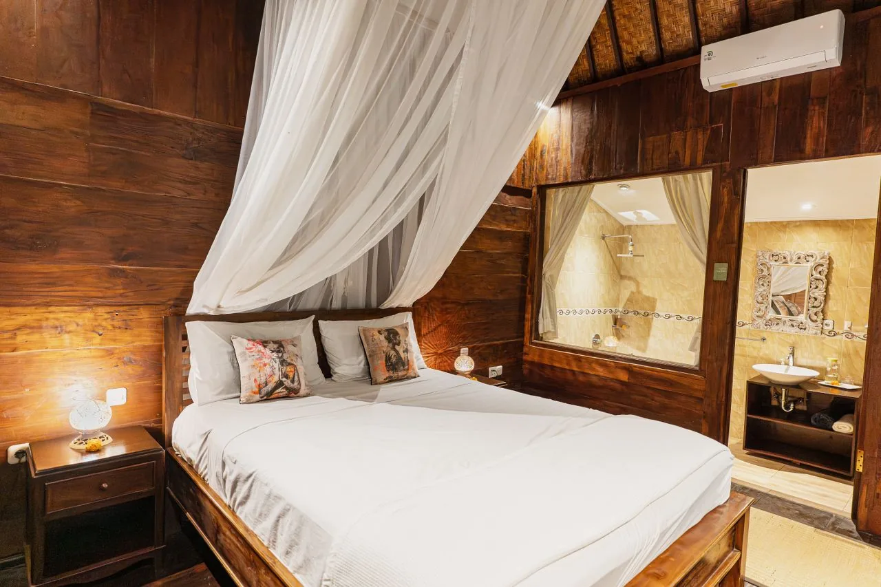 A cottage bedroom, canopy bed and teak walls