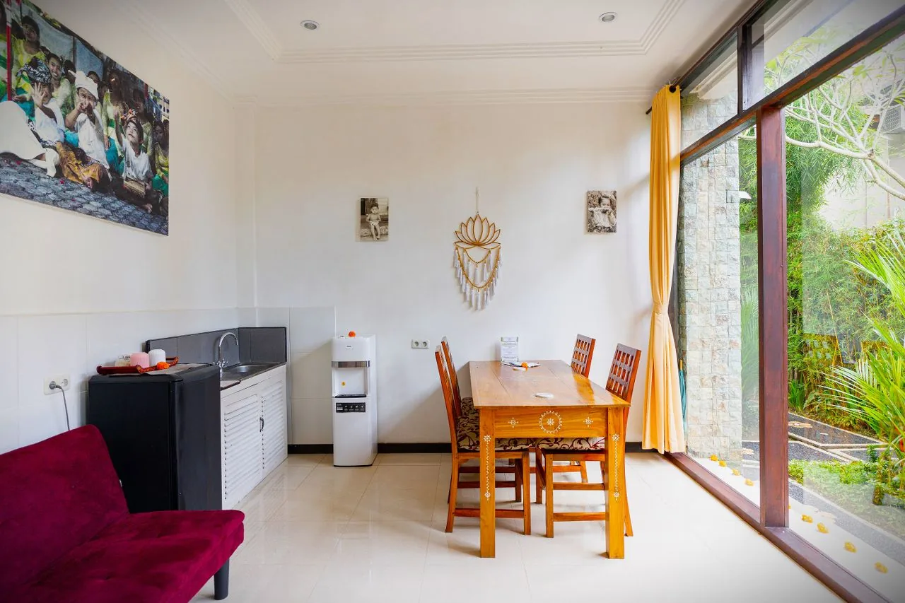 A cottage living room with a kitchen corner