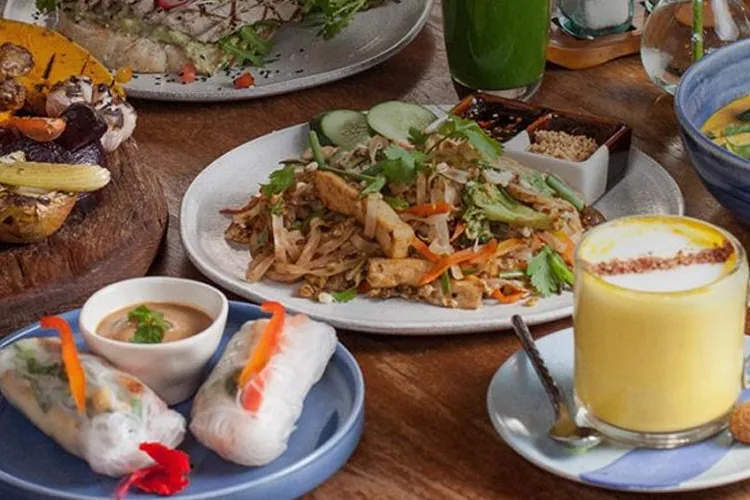 Several dishes from KAFE’s menu on a wooden table