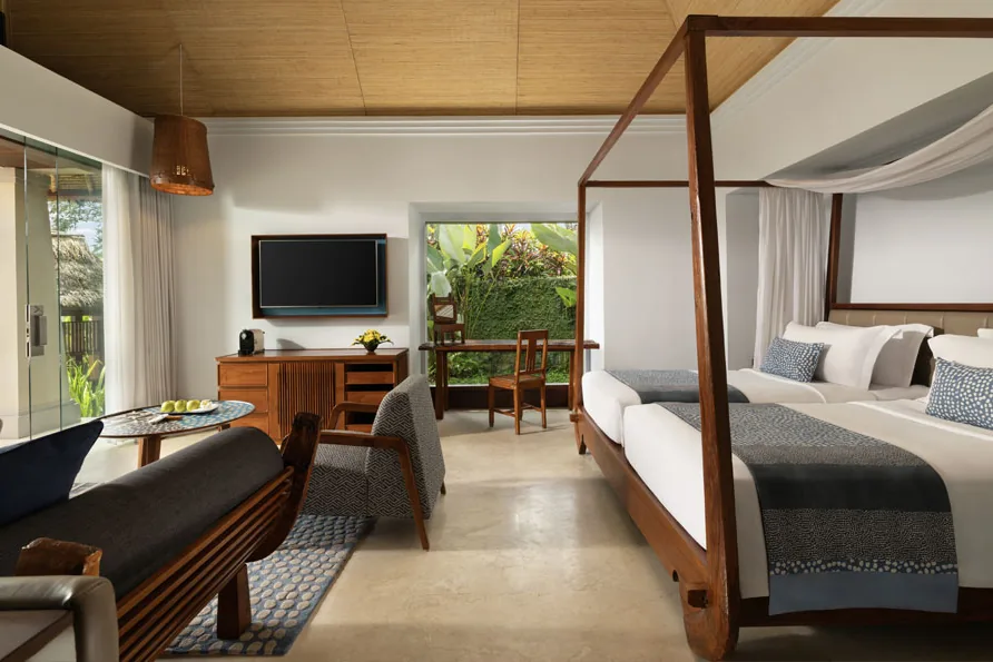The bedroom of a pool villa