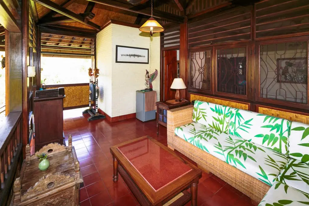 The sitting area and bedroom of The Room