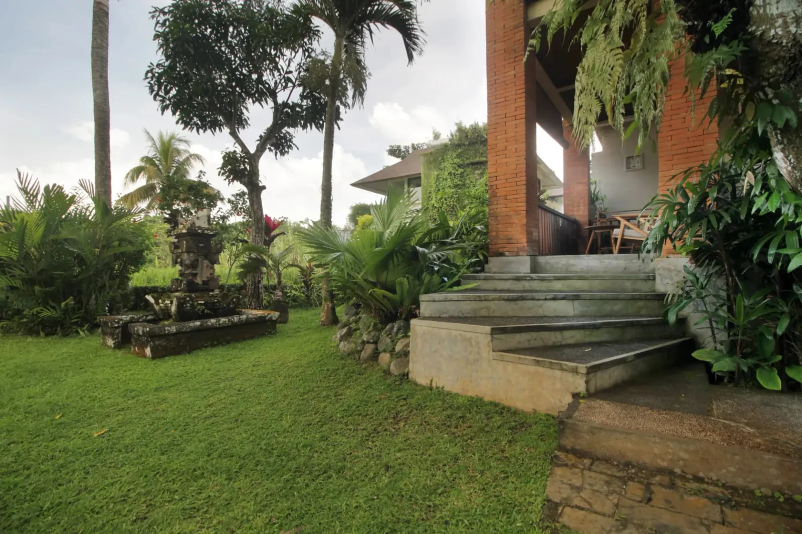 The garden and the steps up to a room block